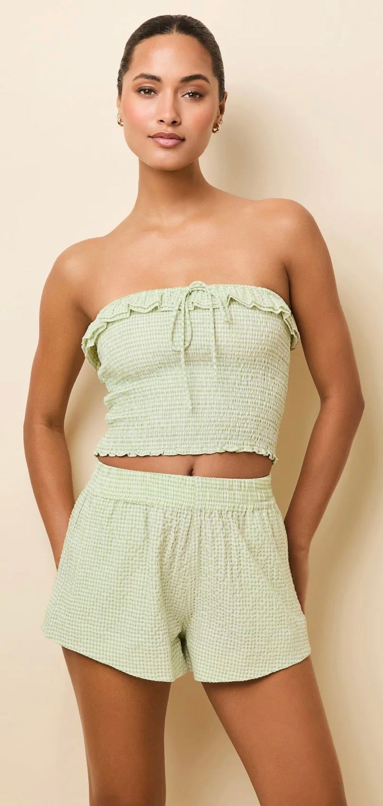 Woman wearing The Vicky Shorts matcha gingham seersucker pull-on shorts with elastic waistband and pockets