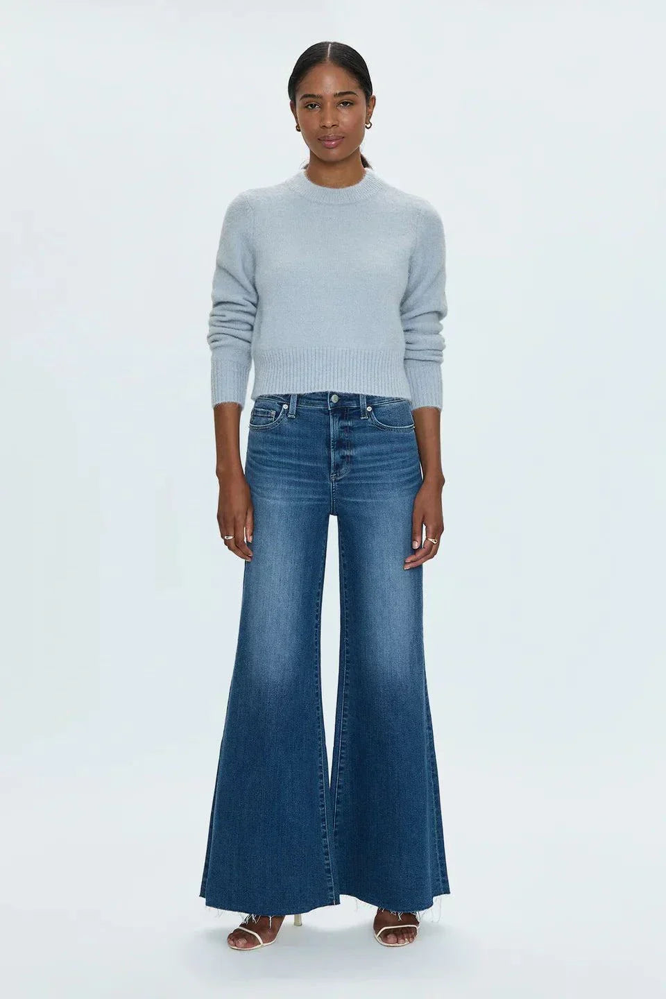 Woman wearing Izzy Jeans Study PISTOLA high-rise slim straight-leg denim jeans in Study wash