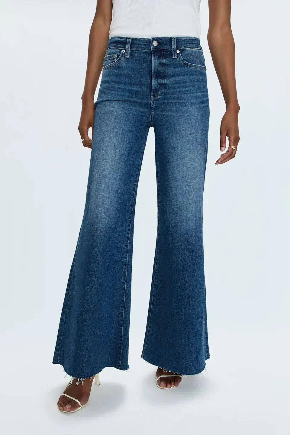 Woman wearing high-rise slim straight-leg blue denim Izzy Jeans Study PISTOLA