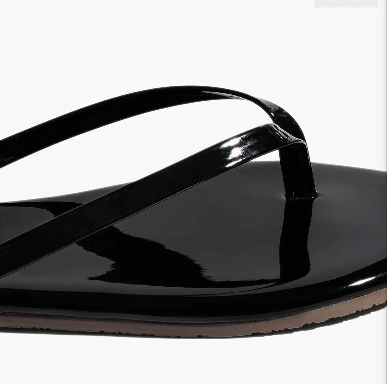 Gloss Licorice TKEES black patent leather flip flop with cushioned insole and rubber outsole