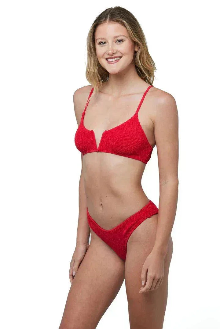 Woman wearing red Ibiza Bikini Red LOVE&BIKINIS with adjustable straps and v-neck design