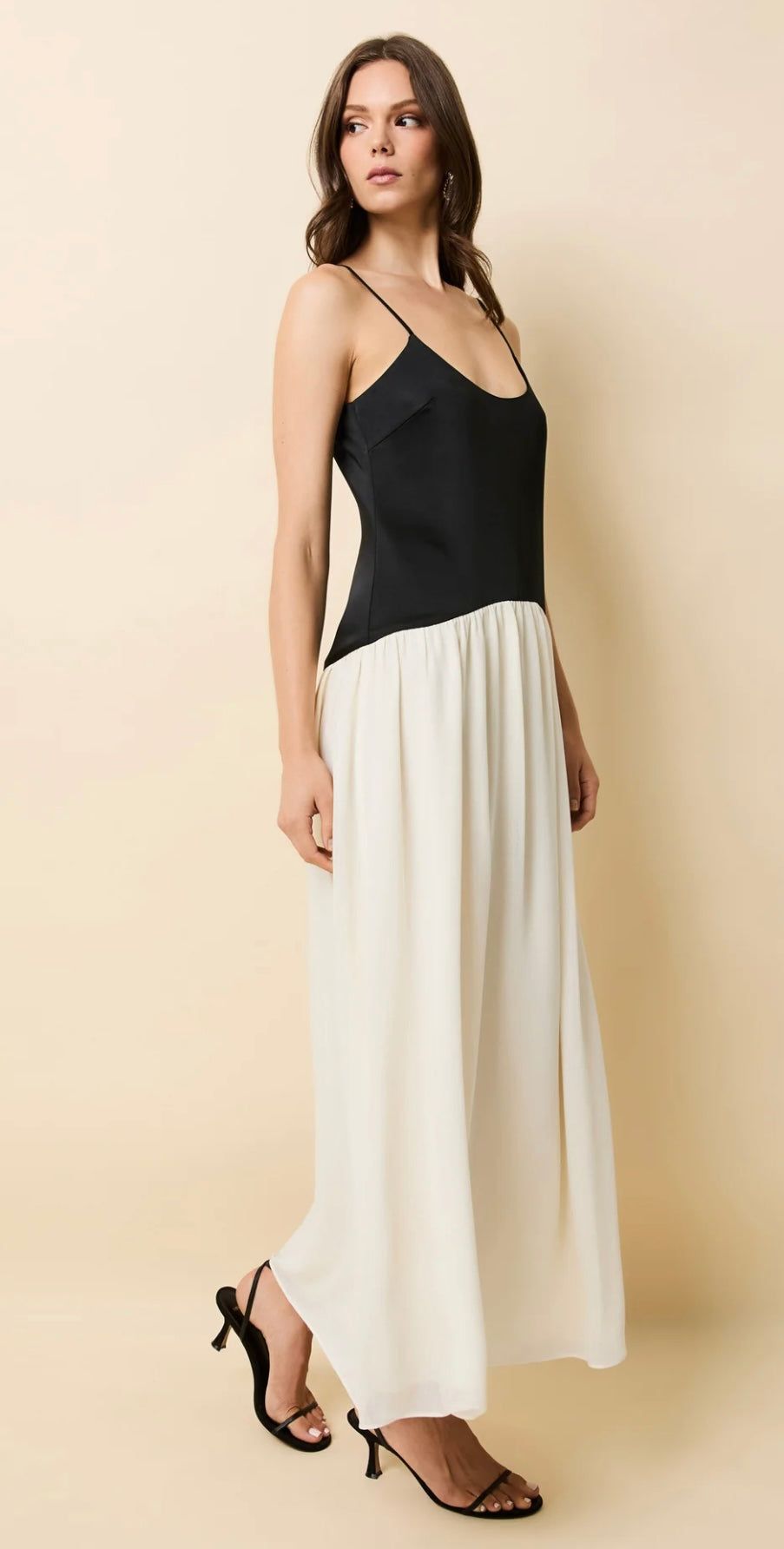 Woman wearing The Tallula Noir black bodice and white overlay skirt dress with adjustable straps and low scoop back