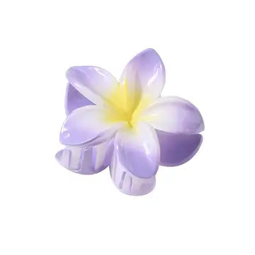 Hawaiian flower-shaped hair clip in purple and yellow colors