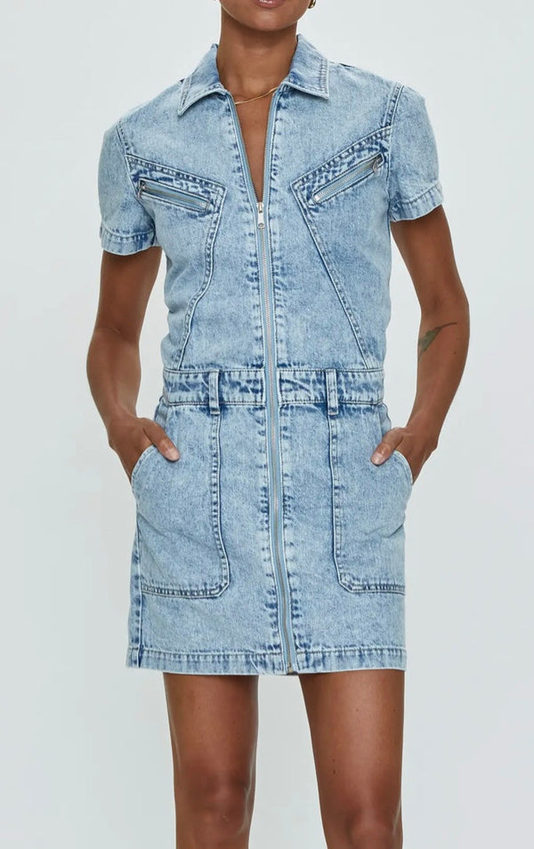 Woman wearing Brix Aviator Denim Dress with zipper front and short sleeves in light blue denim