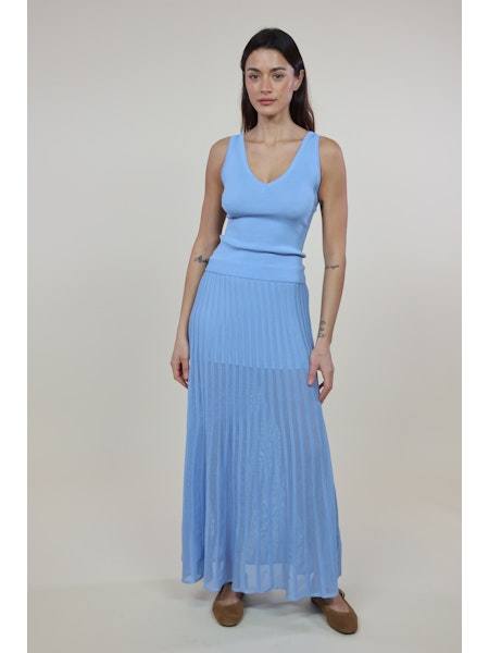 Woman wearing The Bridget Skirt blue pleated maxi skirt by SOLID&STRIPED with elastic waist