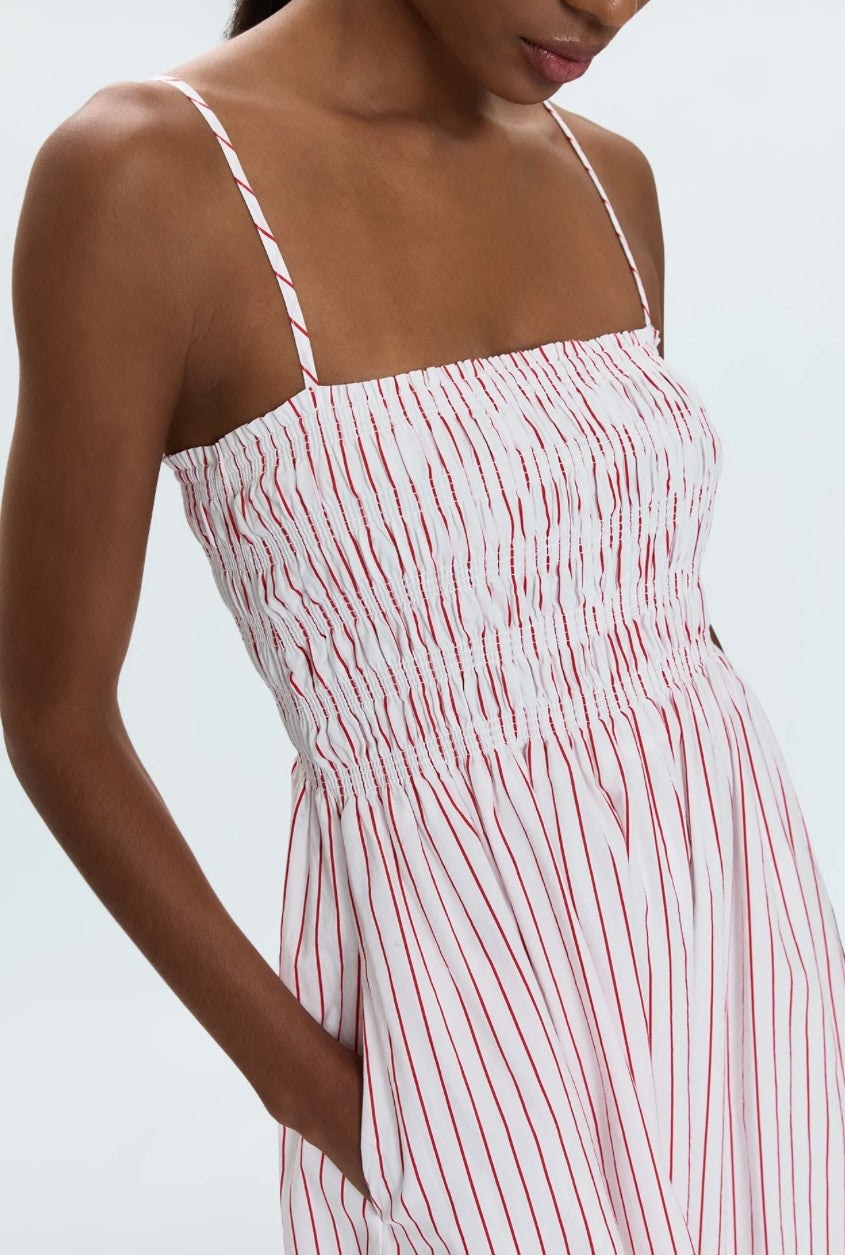 Woman wearing Bianca Shirred Dress with ruby red stripes and ruched bodice