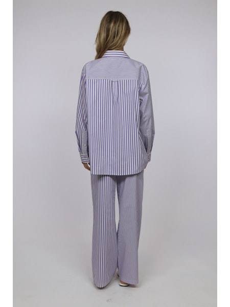 Back view of model wearing The Ashling Pant and matching striped top by SOLID&STRIPED