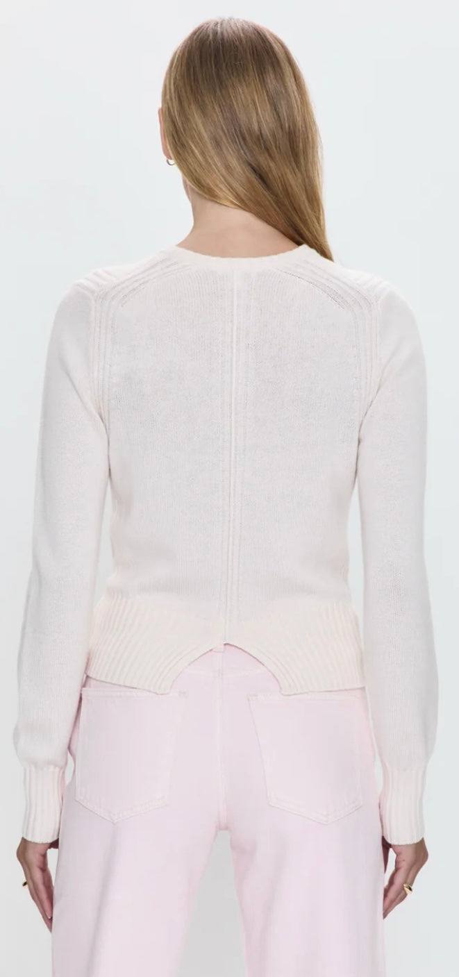 Back view of Taye Shrunken Cardi in barely pink with ribbed detailing and soft texture