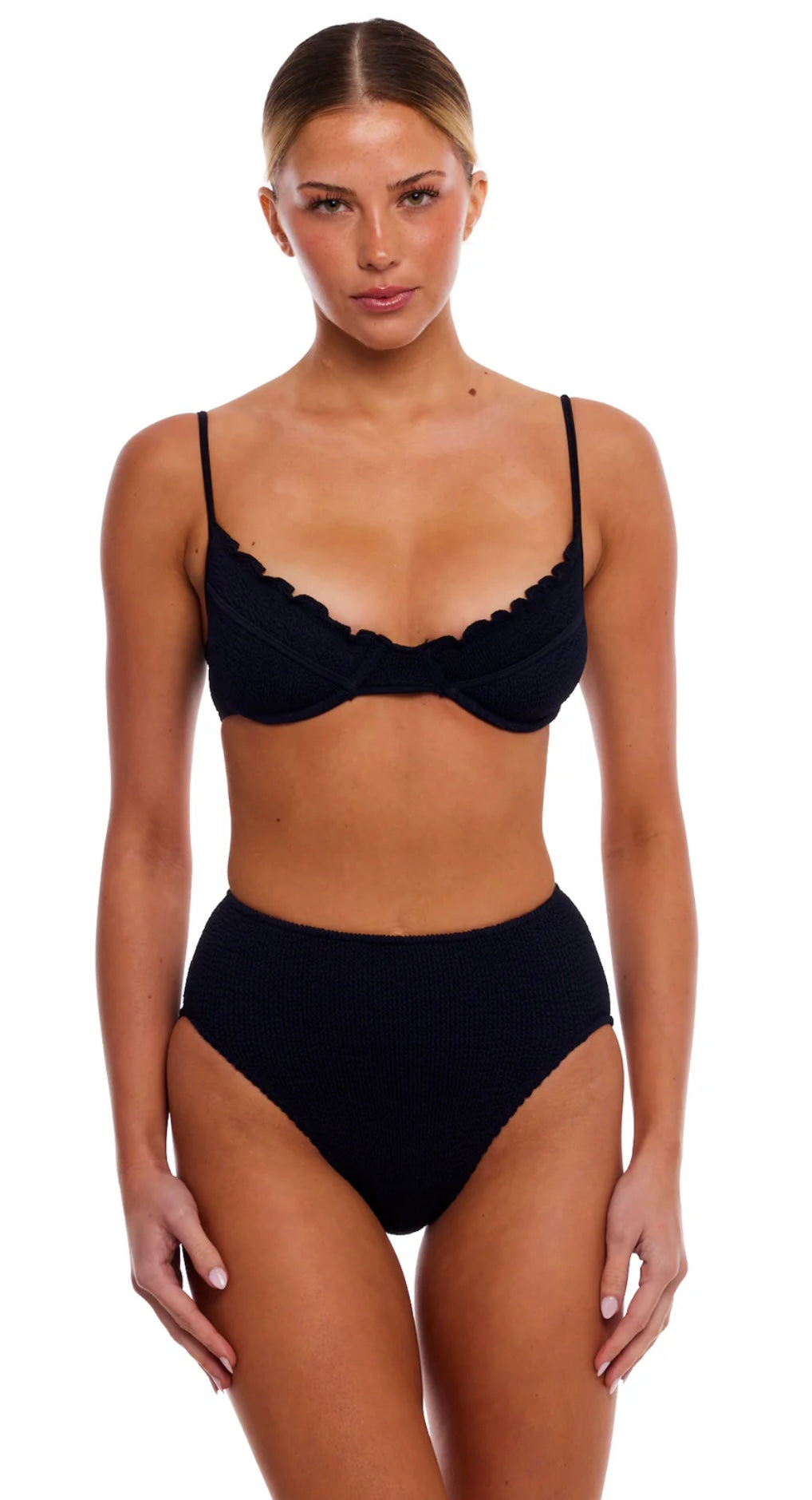 Woman wearing Malibu Scallop black underwire bikini set with scalloped edges