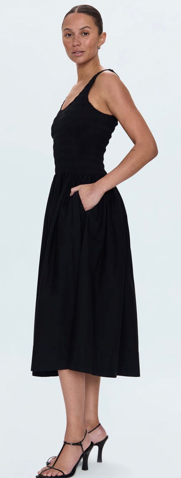 Woman wearing Alessia Dress Noir PISTOLA DENIM black tank midi dress with ruched skirt and elasticated bodice
