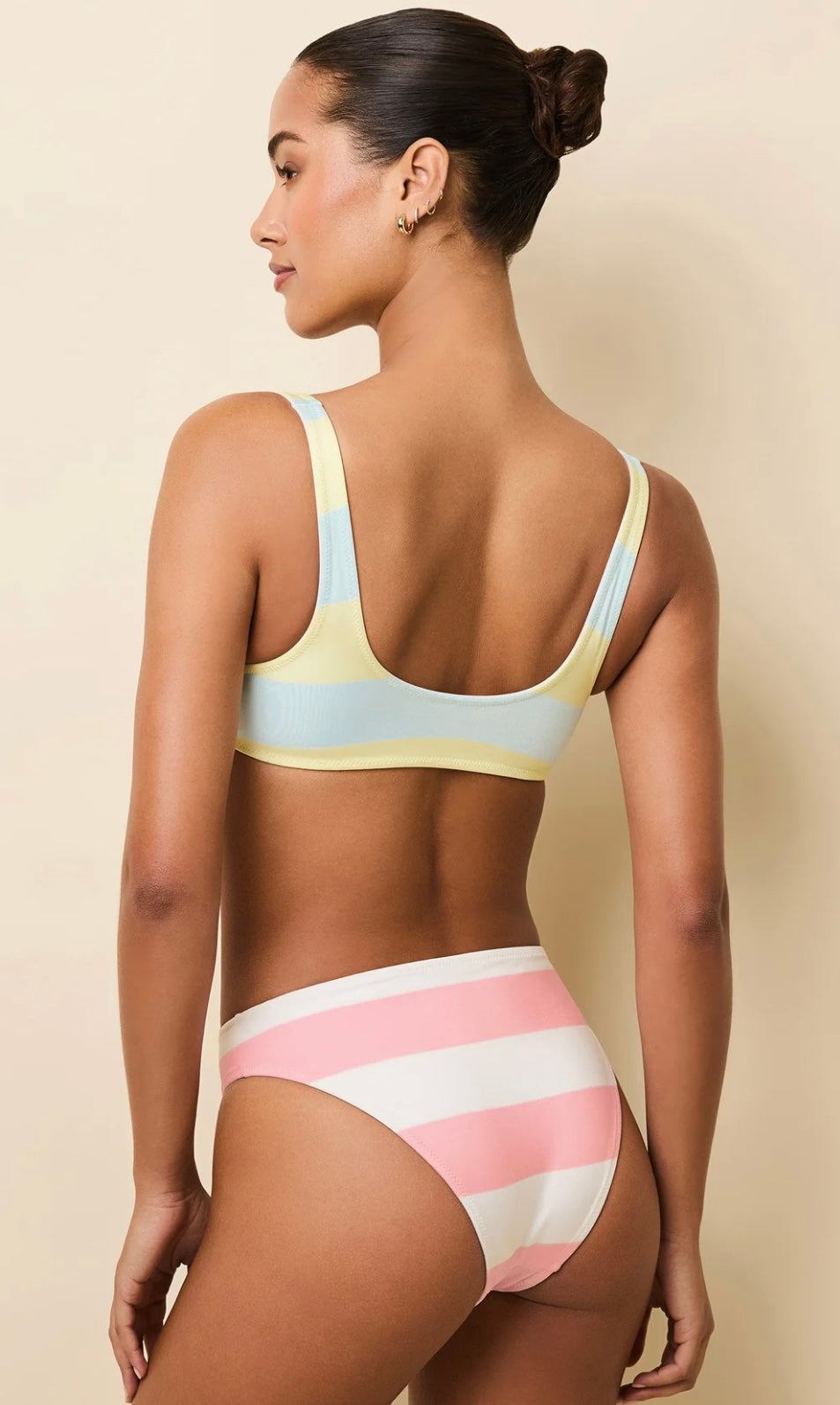 The Elle Reversible Gelato striped bikini set shown from the back on a model