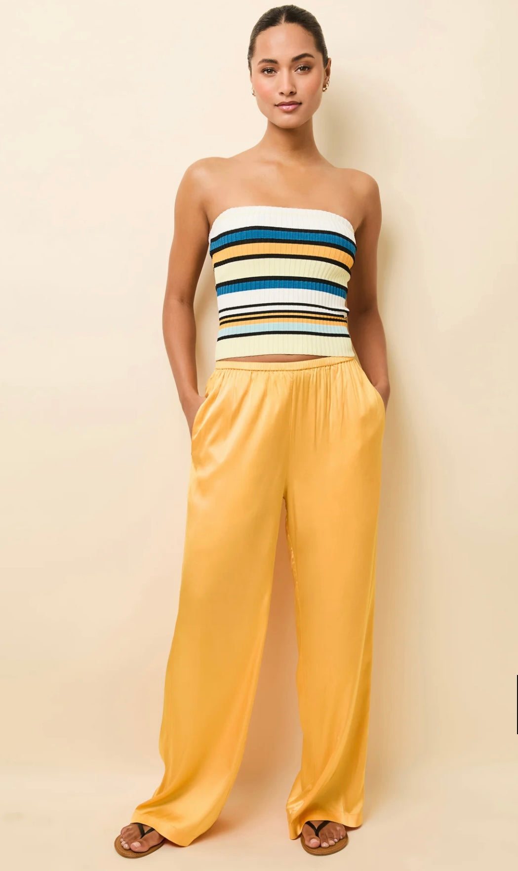 Woman wearing The Monaco Pants mango satin high-waisted relaxed fit with elastic waistband and side pockets