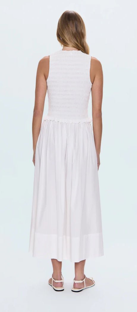 Back view of woman wearing white Noelle Poplin Maxi Skirt with adjustable tie-string waist and sleeveless top