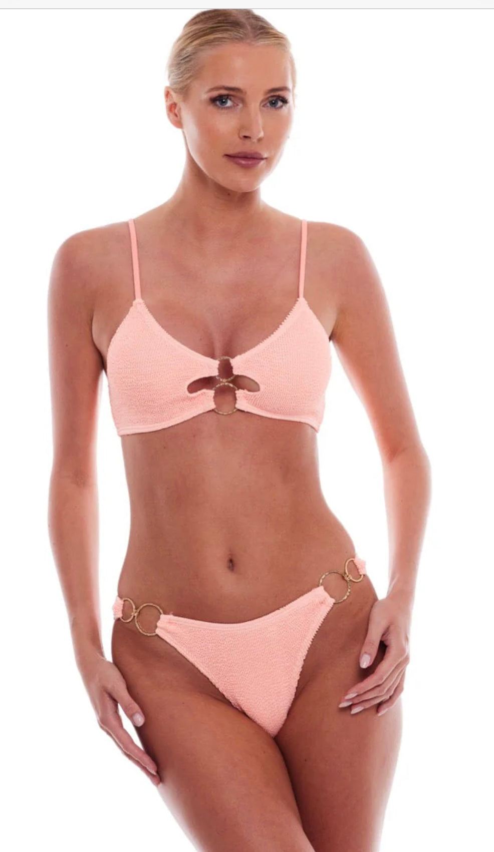Woman modeling peach Dubai Bikini with ring details by LOVE&BIKINIS