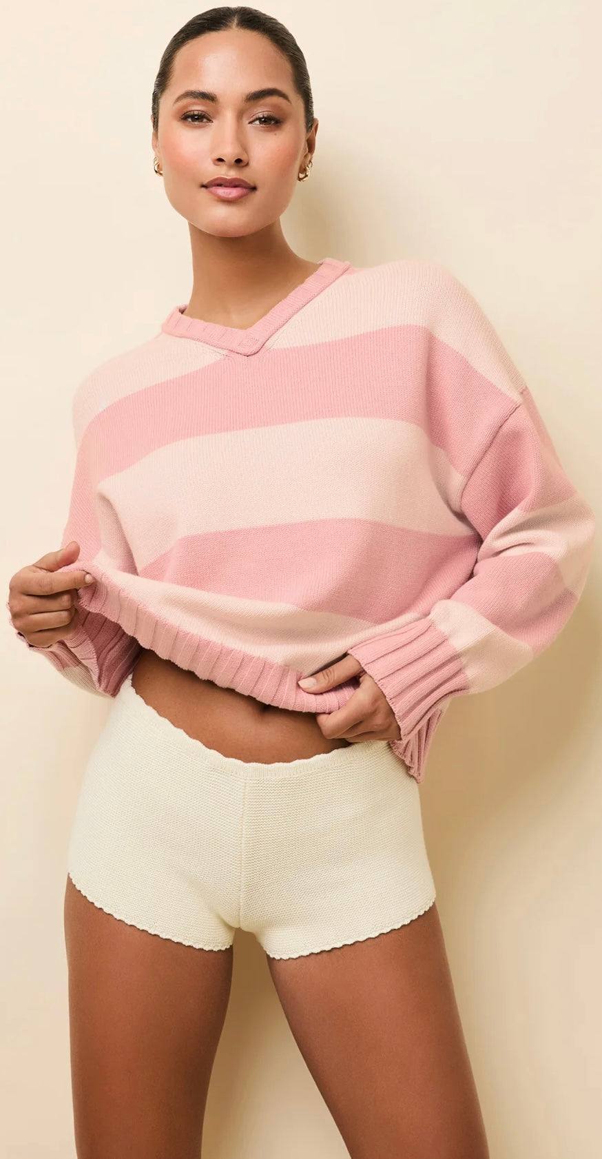 Woman wearing Reva Gelato Stripe soft cotton oversized pullover with pink and cream stripes