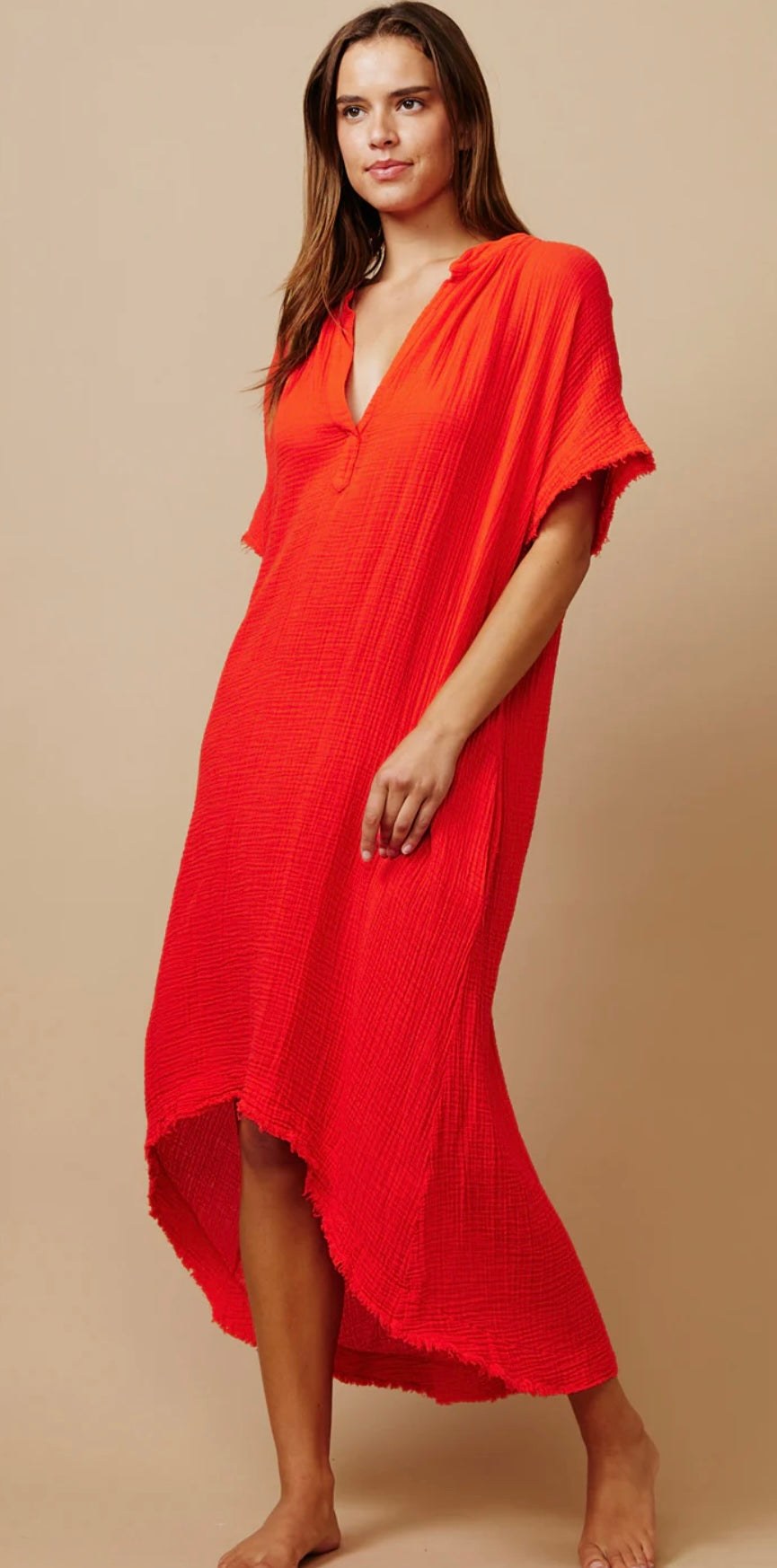 Woman wearing vibrant red Tunisia Caftan Dhalia 9SEED dress