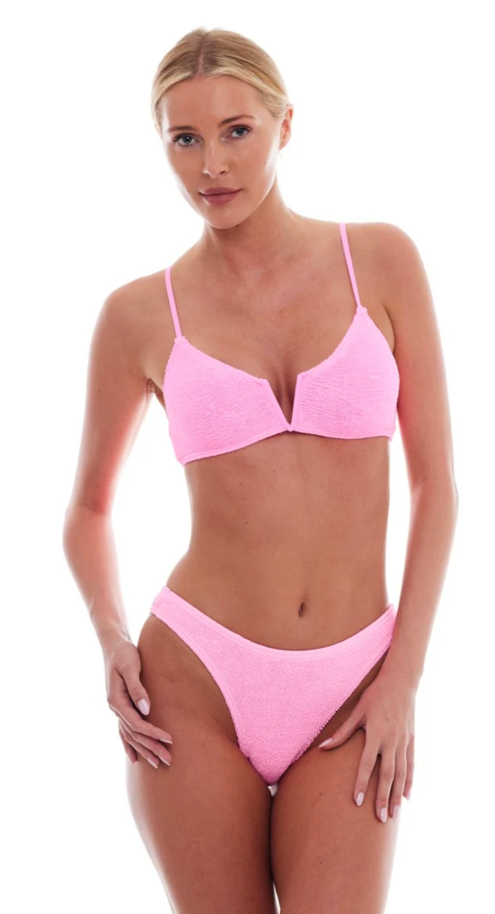 Woman wearing strawberry pink Ibiza Bikini with V-neck and adjustable straps