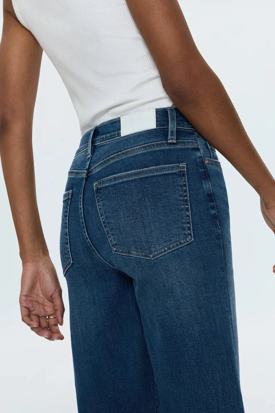 Back view of person wearing Izzy Jeans Study PISTOLA high-rise slim straight-leg denim jeans