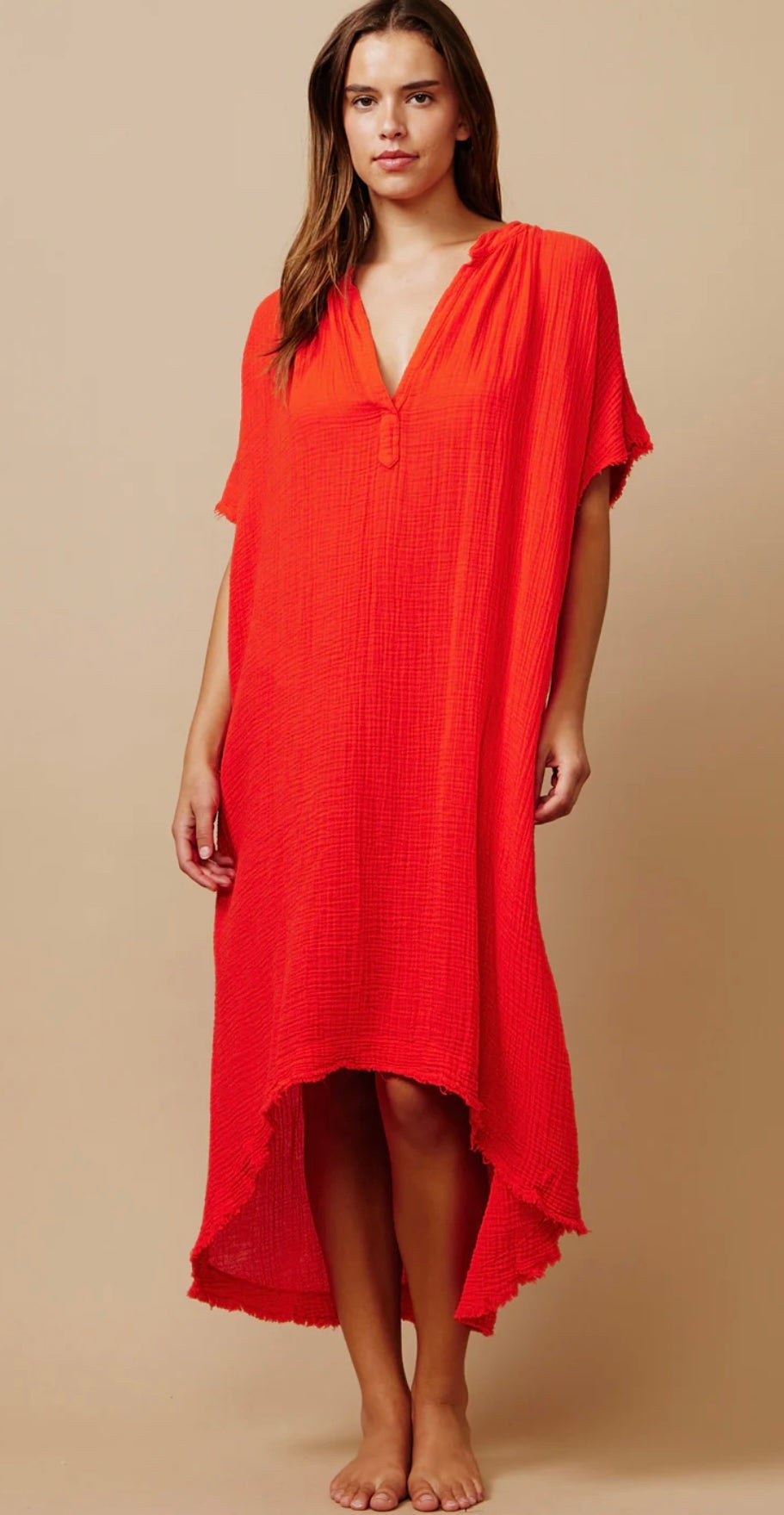 Woman wearing bright red Tunisia Caftan Dhalia 9SEED with loose fit and V-neck design