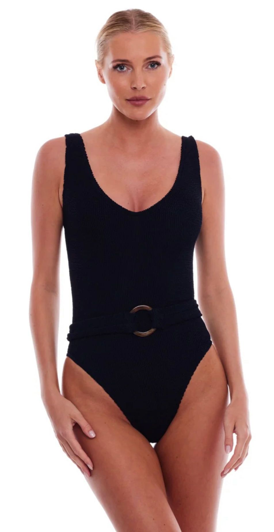 Woman wearing black Florence Tortoise Ring one-piece swimsuit with a scoop neckline and tortoise ring belt.