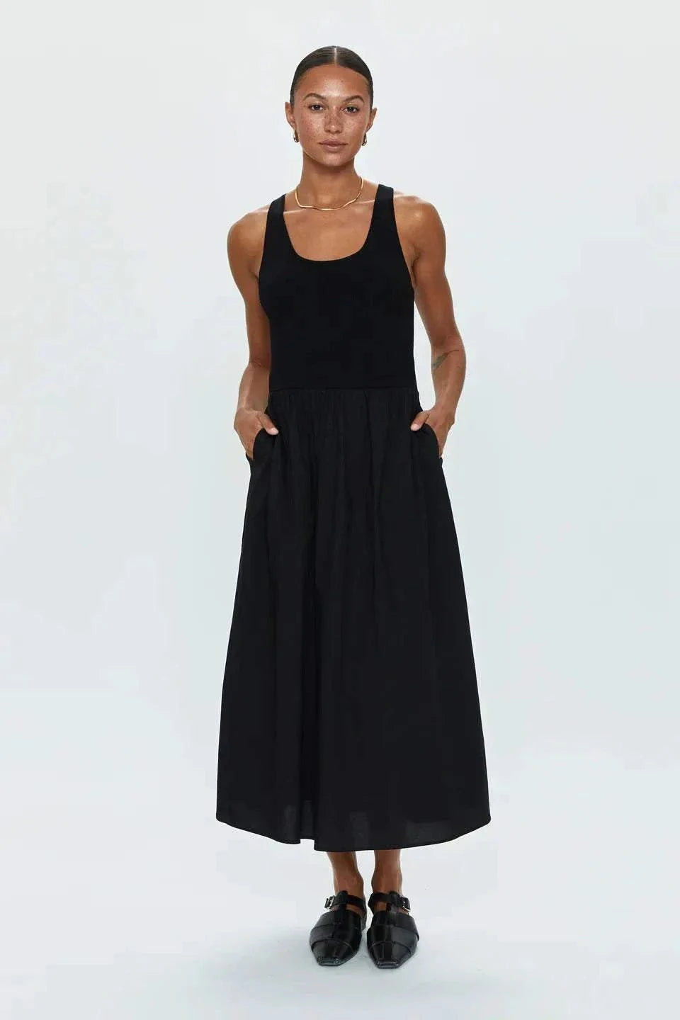 Woman wearing Faye Tank Dress Noir by PISTOLA DENIM with sleeveless design and relaxed skirt in black