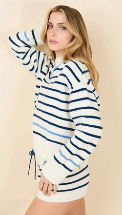 The Maxine Sweater striped blue and white cotton wool blend with wide ribbed cuffs and side slits on model