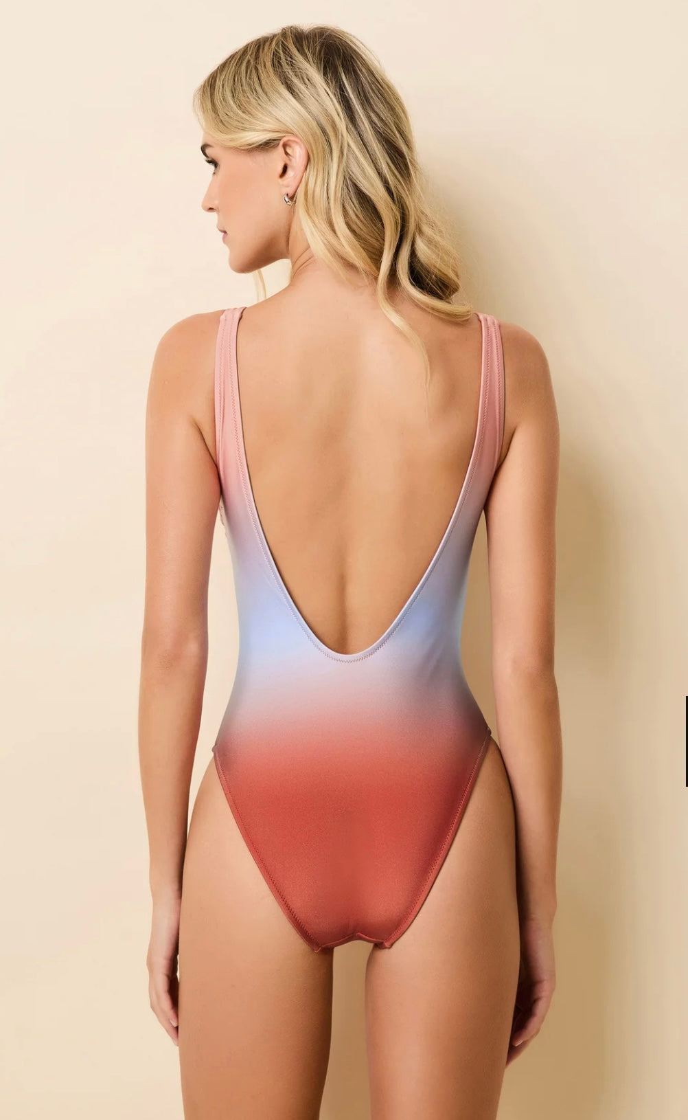 The Hailey Ombré Peachy Keen one-piece swimsuit with scoop neckline and low back.
