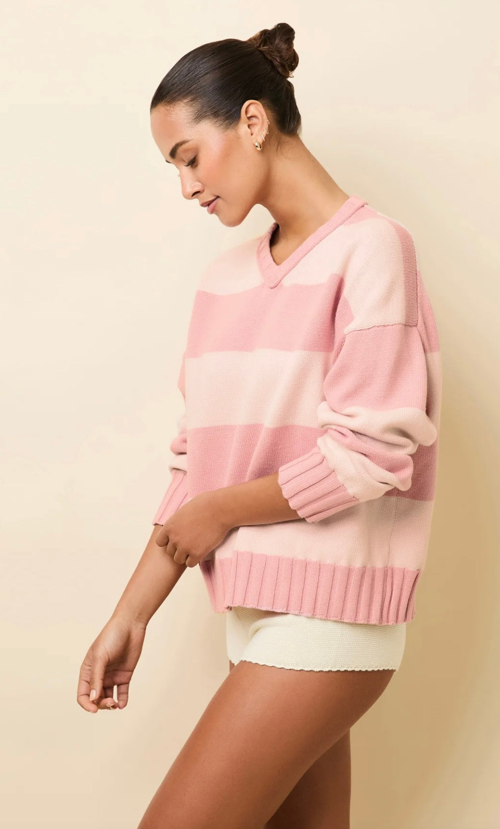 woman wearing pink and cream striped Reva Gelato Stripe pullover sweater