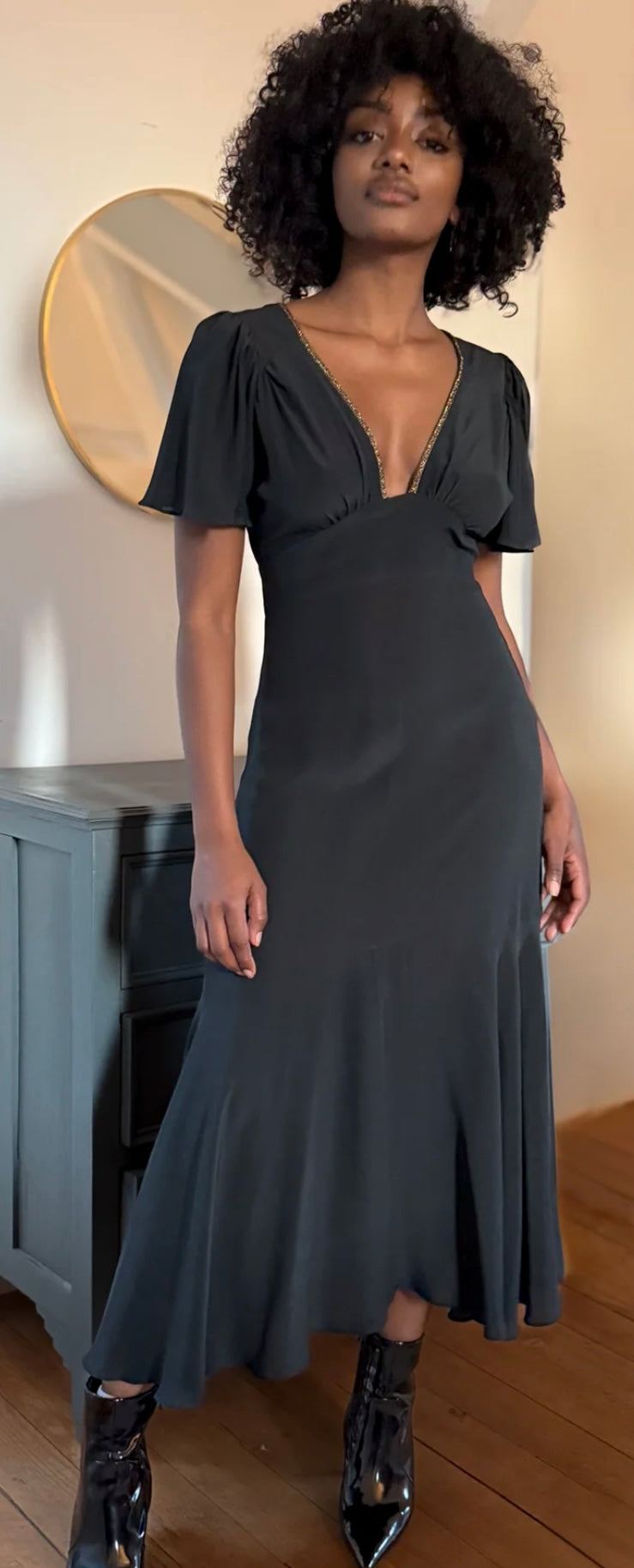 The Iris Noir black elegant dress by HANSINE LONDON worn by model