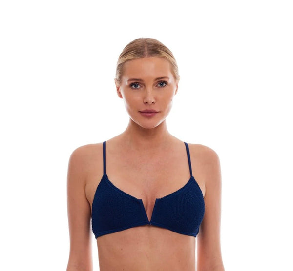 Woman wearing Ibiza Navy LOVE&BIKINS bikini with stylish v-neck and adjustable straps