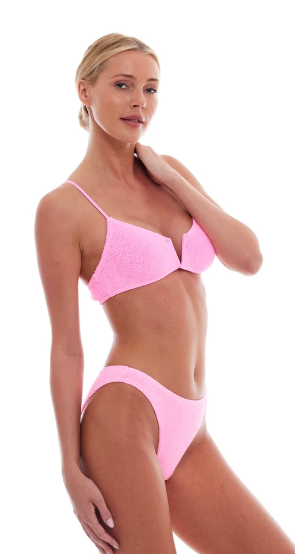 Woman wearing strawberry pink Ibiza Bikini with v-neck and adjustable straps