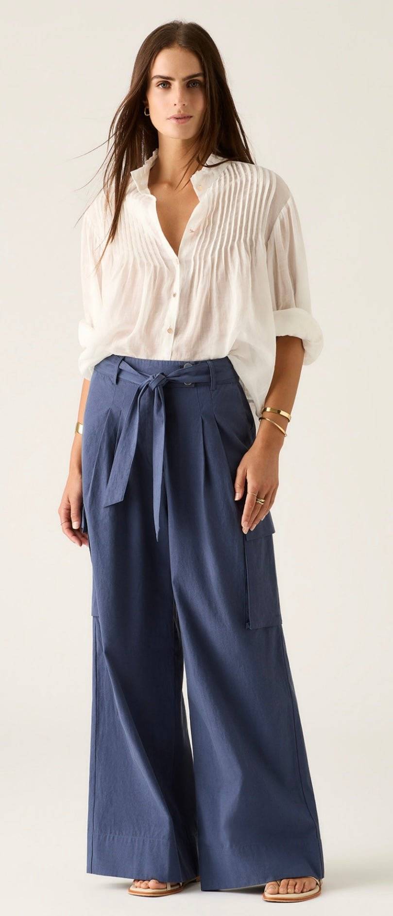 Aaliyah Blouse ivory lightweight pleated blouse with ruffle neckline and gold buttons