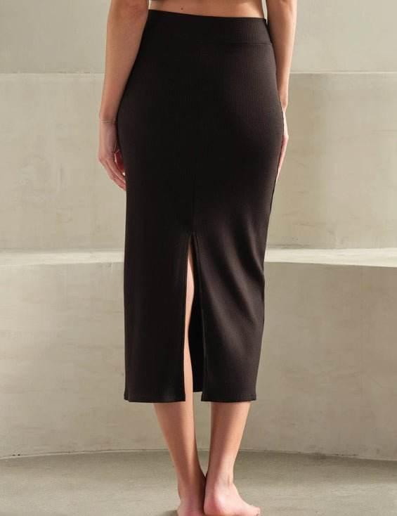 Back Slit LuxRib Midi Skirt in black with ribbed texture and rear slit for easy movement