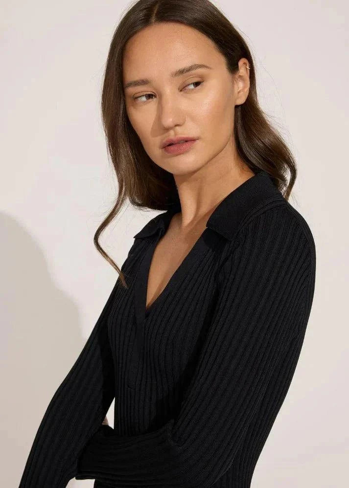 Woman wearing long-sleeve V-neck black Geena Dress by SOLID&STRIPED