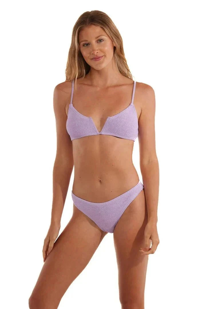 Woman wearing Ibiza Lilac LOVE&BIKINIS adjustable strap bikini with v-neck embellishment