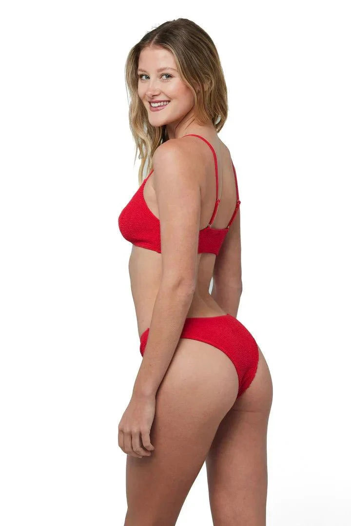 Woman wearing Ibiza Bikini Red LOVE&BIKINIS with adjustable straps and v-neck design