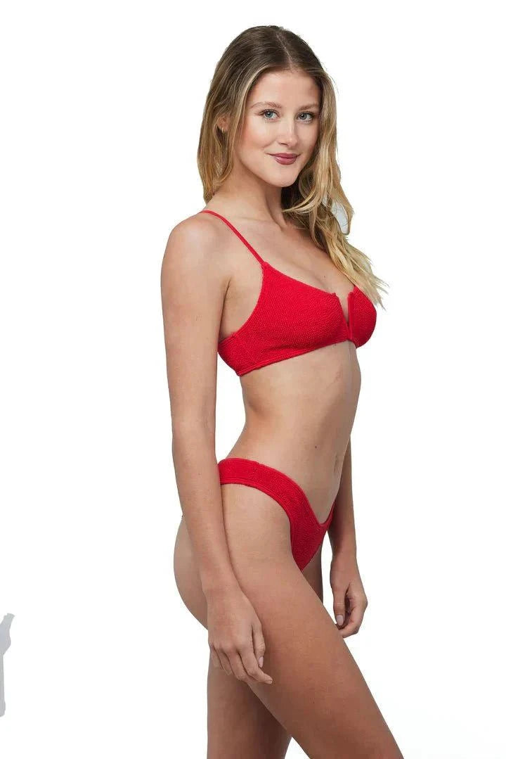 Woman wearing red Ibiza Bikini Red LOVE&BIKINIS with adjustable straps and v-neck design