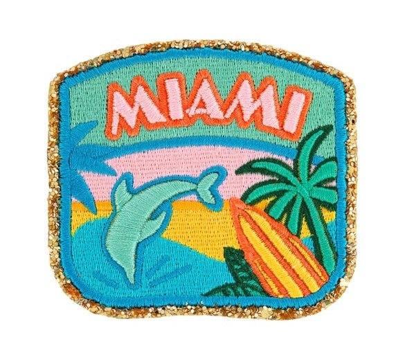 Miami city patch with dolphin, palm tree, and surfboard design by Stoney Clover Lane