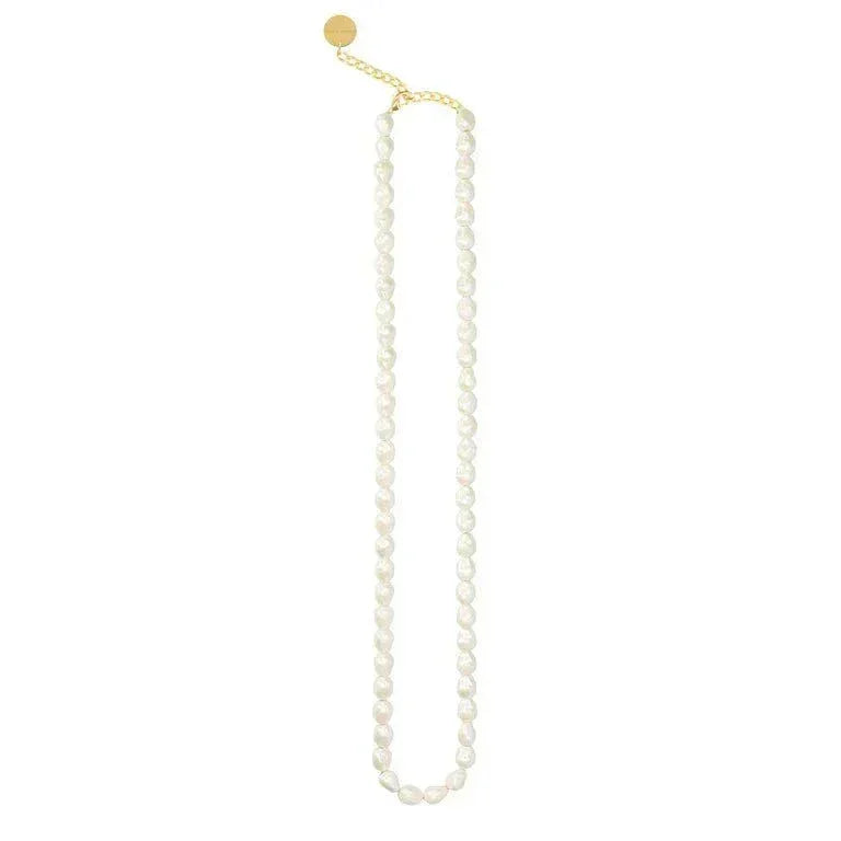 Organic pearl long necklace with gold toned chain and circular pendant by Vanessa Baroni