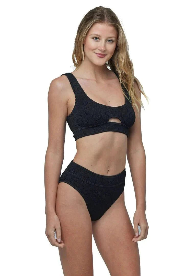 Sardinia Bikini black with cut-out top and high-waisted bottoms on model