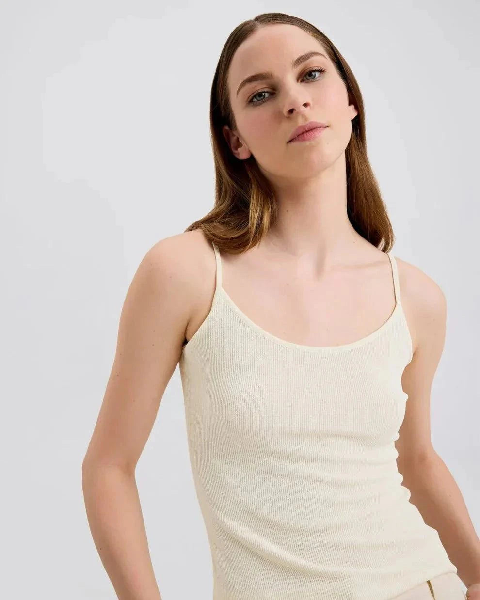 Woman wearing Selena Tank ecru slim fit knit top with square neckline