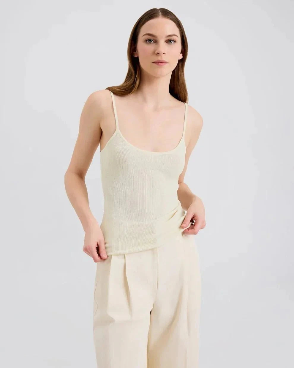 Woman wearing Selena Tank ecru slim fit knit top with square neckline and thin straps