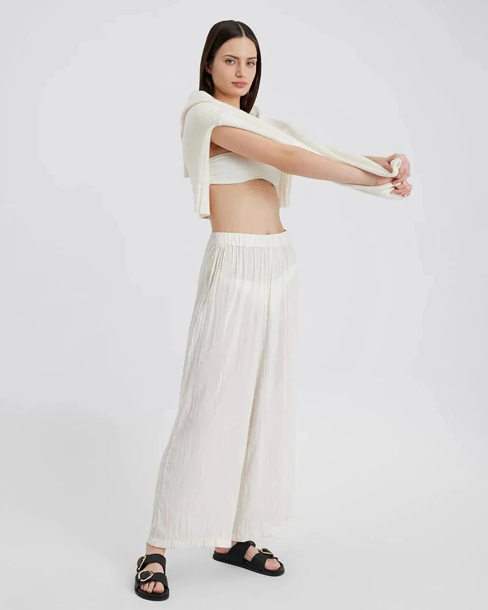 Woman wearing The Milly Pant ecru lightweight crinkle fabric high waist raw hem