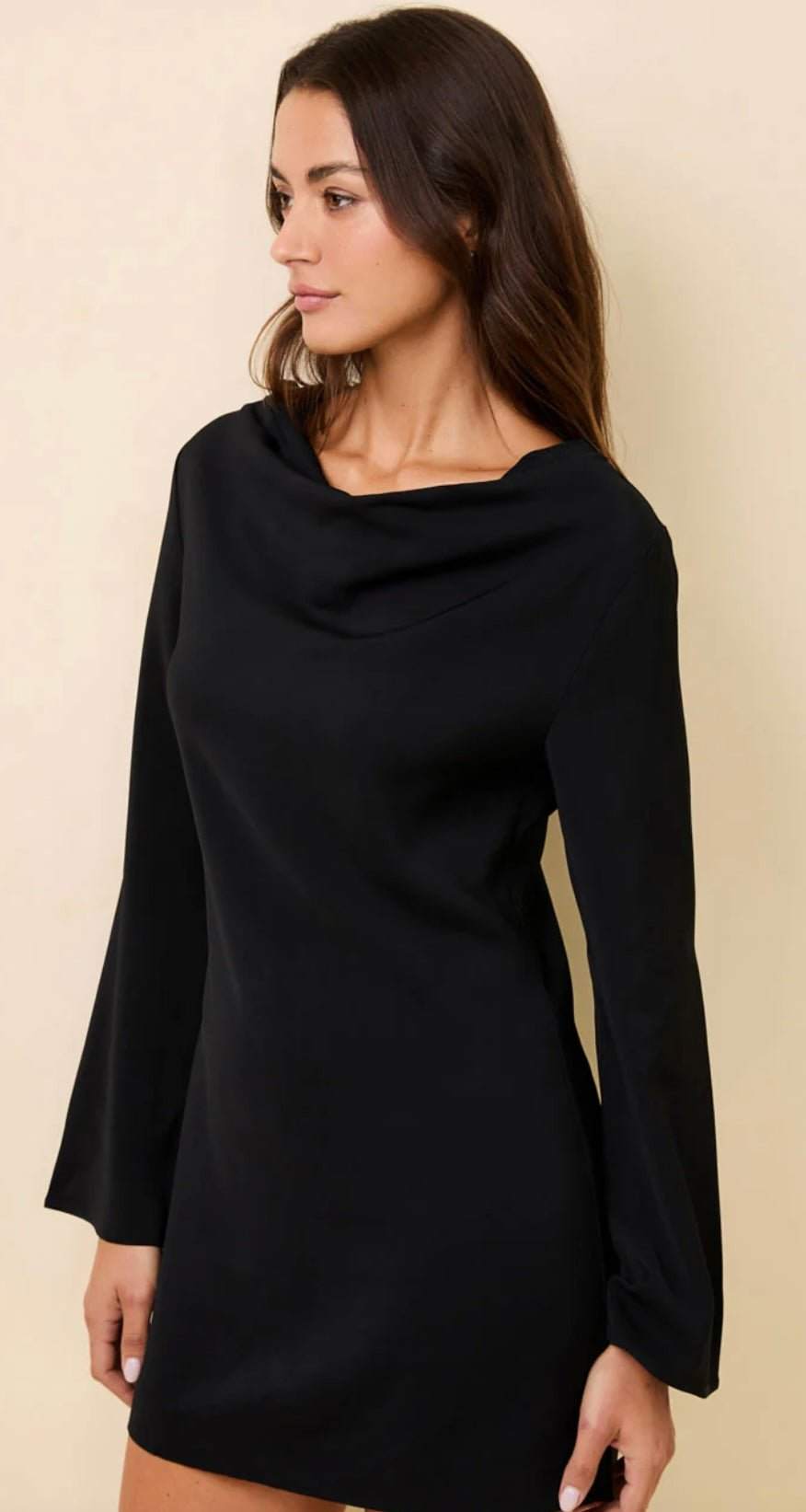 The Nili Mini Noir black mini dress with long flute sleeves and draped cowl neckline