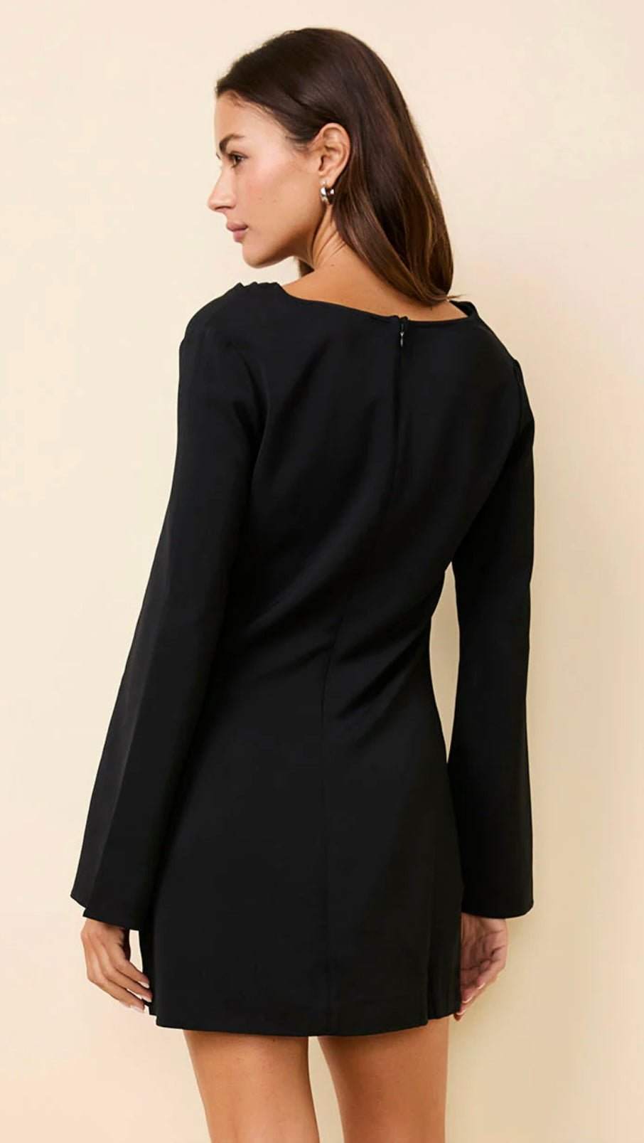The Nili Mini Noir black mini dress with long sleeves and back zipper closure