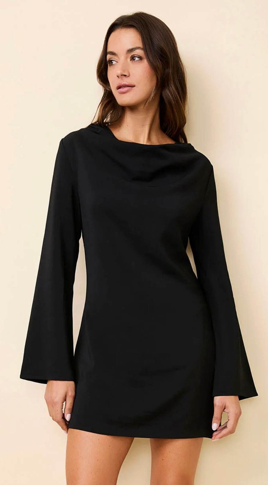 The Nili Mini Noir black mini dress with long flute sleeves and draped cowl neckline
